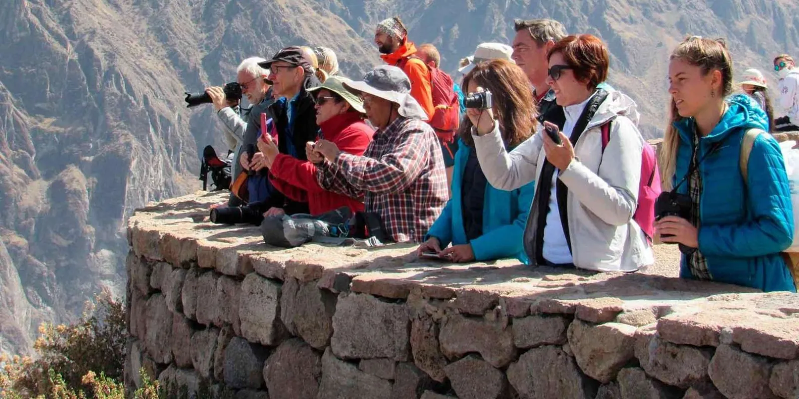 Visitors photographing the canyon