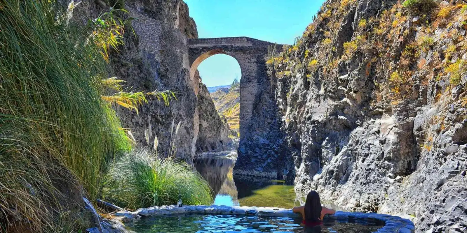 Stone bridge and riverside pools
