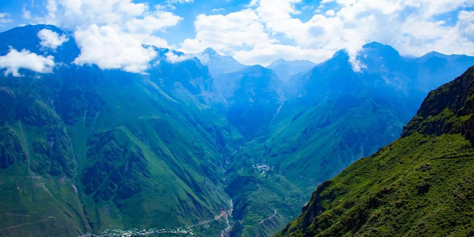Deep green slopes and steep walls of Colca Canyon