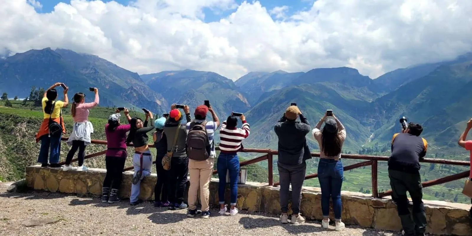 Travellers at a highland scenic stop