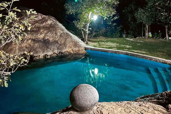 Swimming pool beside canyon cliffs