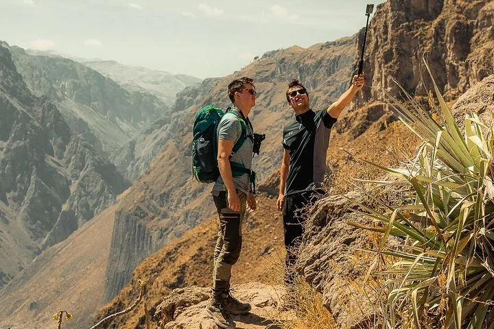 Hikers resting on a canyon trail