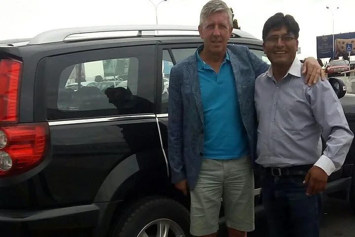 Driver and passenger beside the vehicle